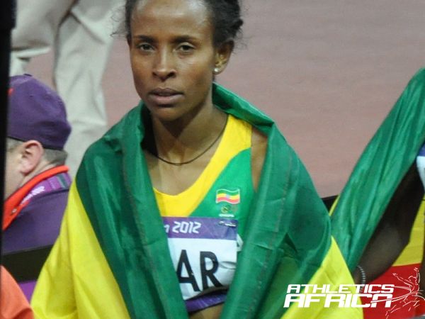 Meseret Defar walking away from the track after her winning celebration in London/ Photo: Yomi Omogbeja at the Olympic Stadium