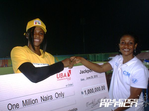 L-R: Passing the Baton - African sprint champion Blessing Okagbare receives a cheque from former African queen, Mary Onyali, at the All-Nigeria Championships in Calabar last year.